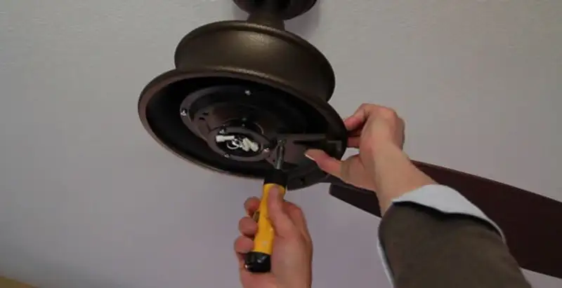 Electrician installing ceiling fan mounting bracket and fixture in Santa Rosa, CA