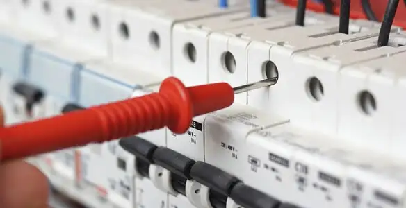 Electrical contractor testing circuit breakers during electrical repair in Windsor, CA
