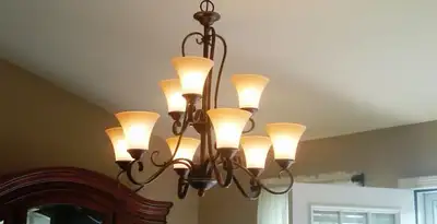 Classic ceiling chandelier installation with warm lighting in Santa Rosa, CA