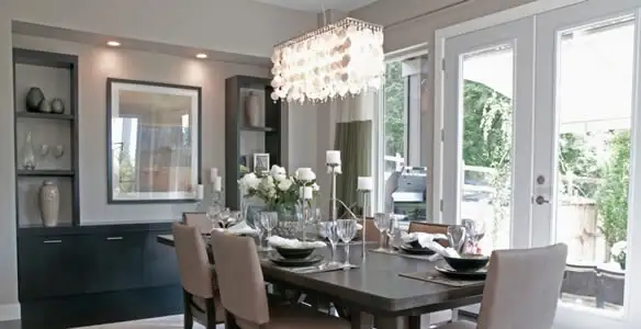 Elegant dining room chandelier installation above table in Santa Rosa, CA