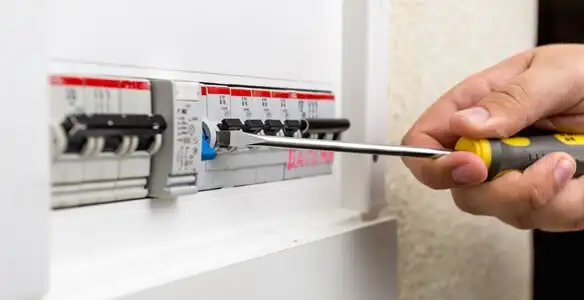 electrical panel upgrade service showing technician adjusting circuit breakers during system upgrade in Santa Rosa, CA