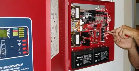 fire alarm installation service showing technician configuring fire alarm control panel in Santa Rosa, CA