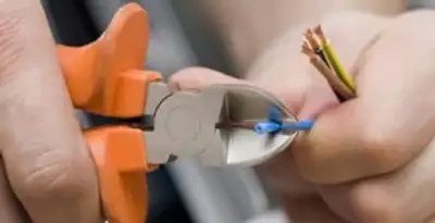 professional electrical services showing precise wire cutting by licensed electricians in Santa Rosa, CA