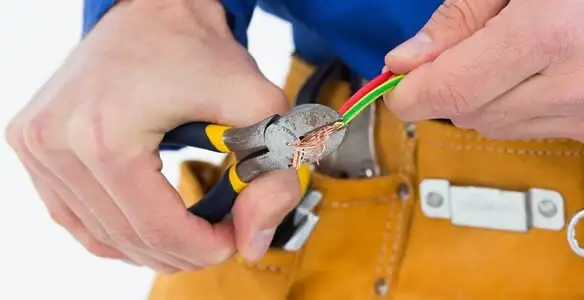 licensed electrician securing electrical wiring with professional tools during service work in Santa Rosa, CA